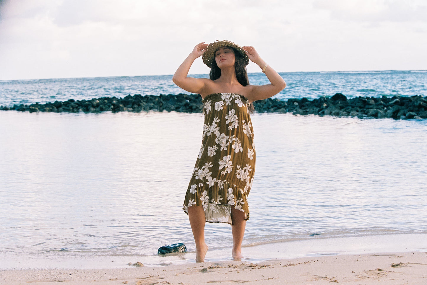 Guava Jammies Mahealani Midi Dress in olive green with white floral print, strapless, high-low hem, rayon voile
