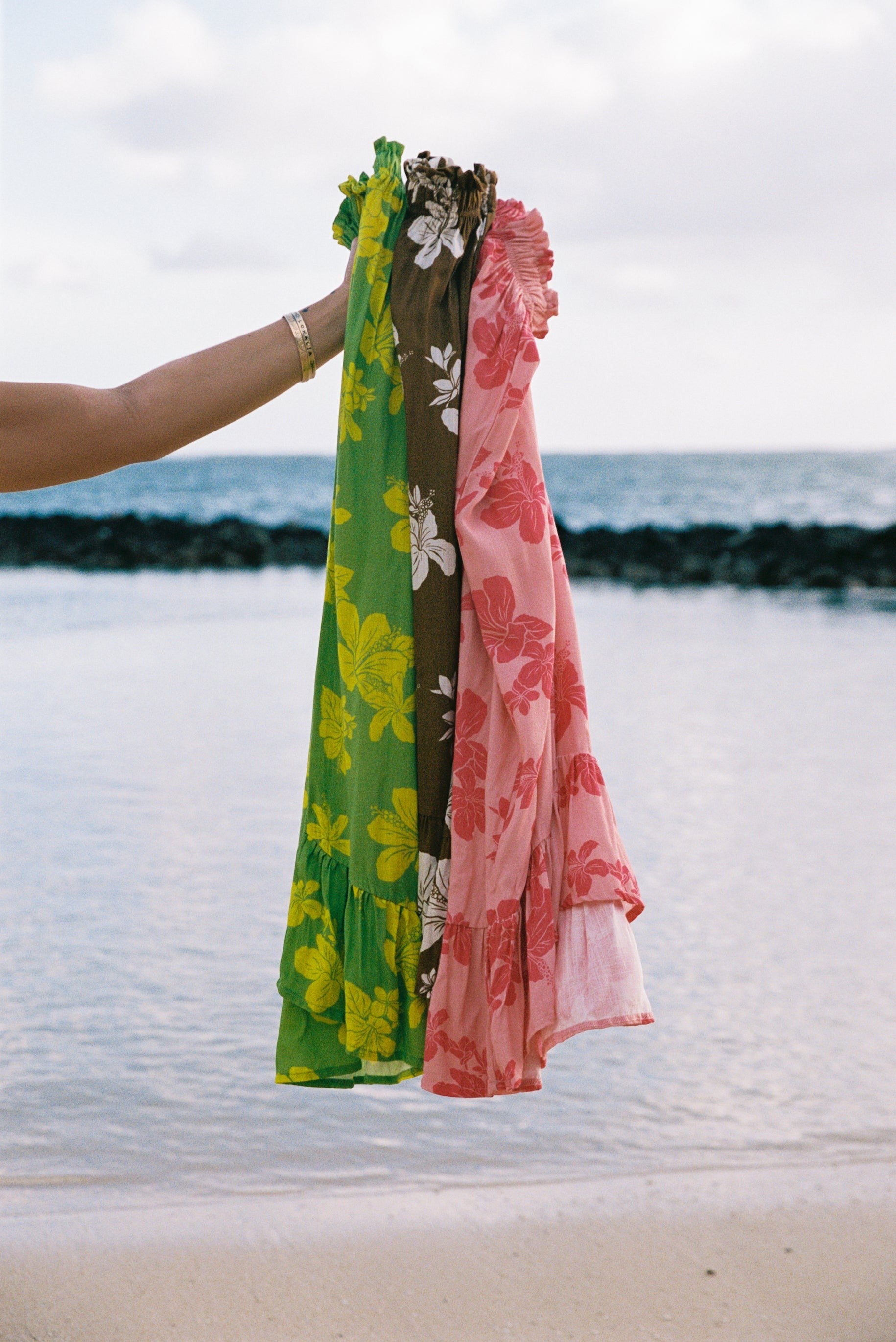 Guava Jammies Mahealani Midi Dress in green, brown, and pink floral print rayon voile. Strapless with ruffled elastic top and high-low hem.