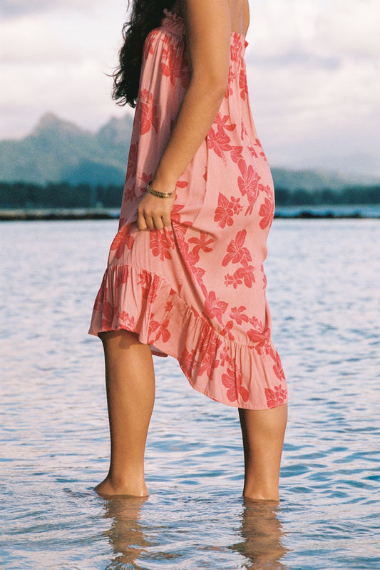 Guava Jammies Mahealani Midi Dress in pink with red hibiscus print, strapless, high-low hem, rayon voile