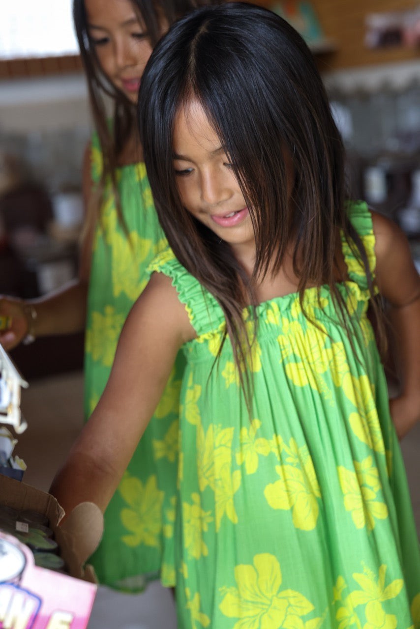 Guava Jammies Mahealani Mini Dress in green with yellow hibiscus print, rayon voile, for girls.