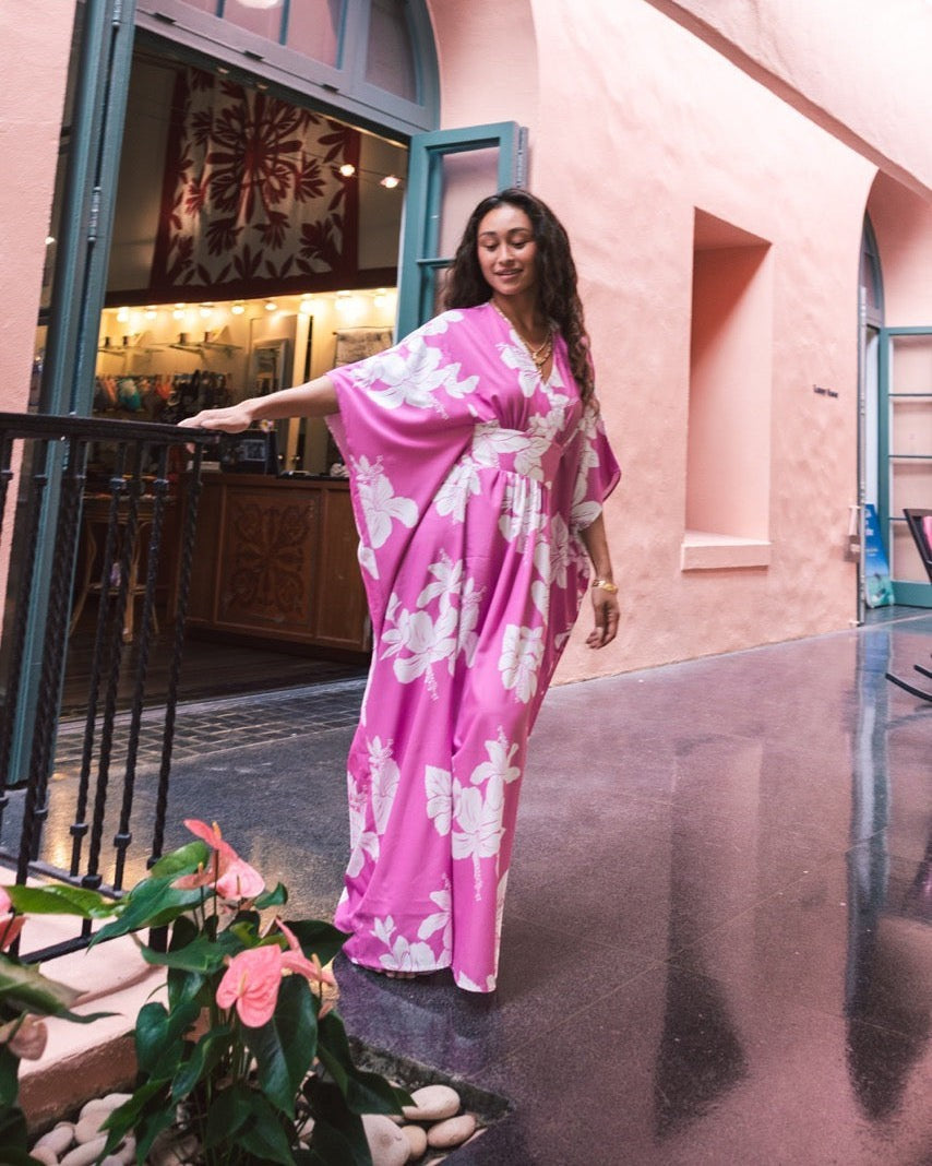 Guava Jammies Poema Island Gown in bright pink with white floral print, V-neck, cinched waist, and waterfall back.